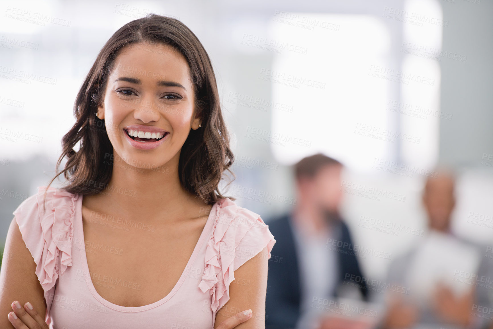 Buy stock photo Cropped shot of a young businesswoman with her colleagues working in the background