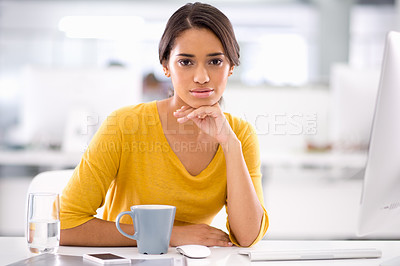 Buy stock photo Cropped shot of an attractive young businesswoman sitting at her desk