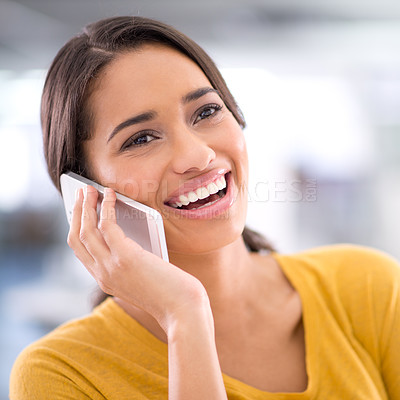 Buy stock photo Cropped shot of an attractive young businesswoman talking on her cellphone