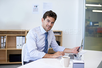 Buy stock photo Portrait, desk and businessman with phone, laptop and coffee at startup with technology. Smile, online and business analyst in office with computer, smartphone and internet connection for networking