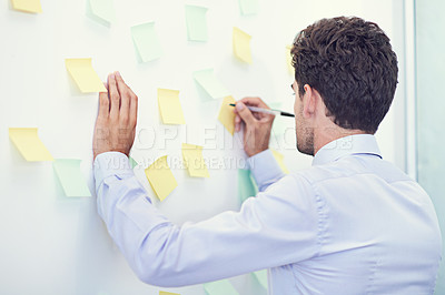 Buy stock photo Businessman, writing and sticky notes in office for planning, brainstorming and project strategy with rear view. Entrepreneur, employee and ideas for agenda, schedule and proposal information at work
