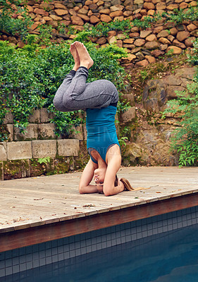 Buy stock photo Full length shot of a young woman practicing yoga