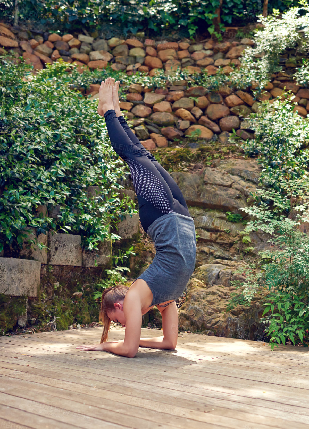 Buy stock photo Yoga, fitness and handstand with girl, balance and outdoor on home patio by pool. Exercise, zen and chakra with woman, garden deck and health workout for holistic summer wellness and meditation