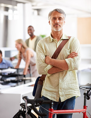 Buy stock photo Mature man, arms crossed and bicycle in office with portrait and manager of sustainable company. Ceo, boss and job with eco friendly commute in morning with smile in creative agency of professional 