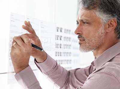 Buy stock photo Senior businessman, writing and schedule planning on glass board for brainstorming or strategy at office. Closeup of mature man working on project plan, agenda or tasks for vision at workplace