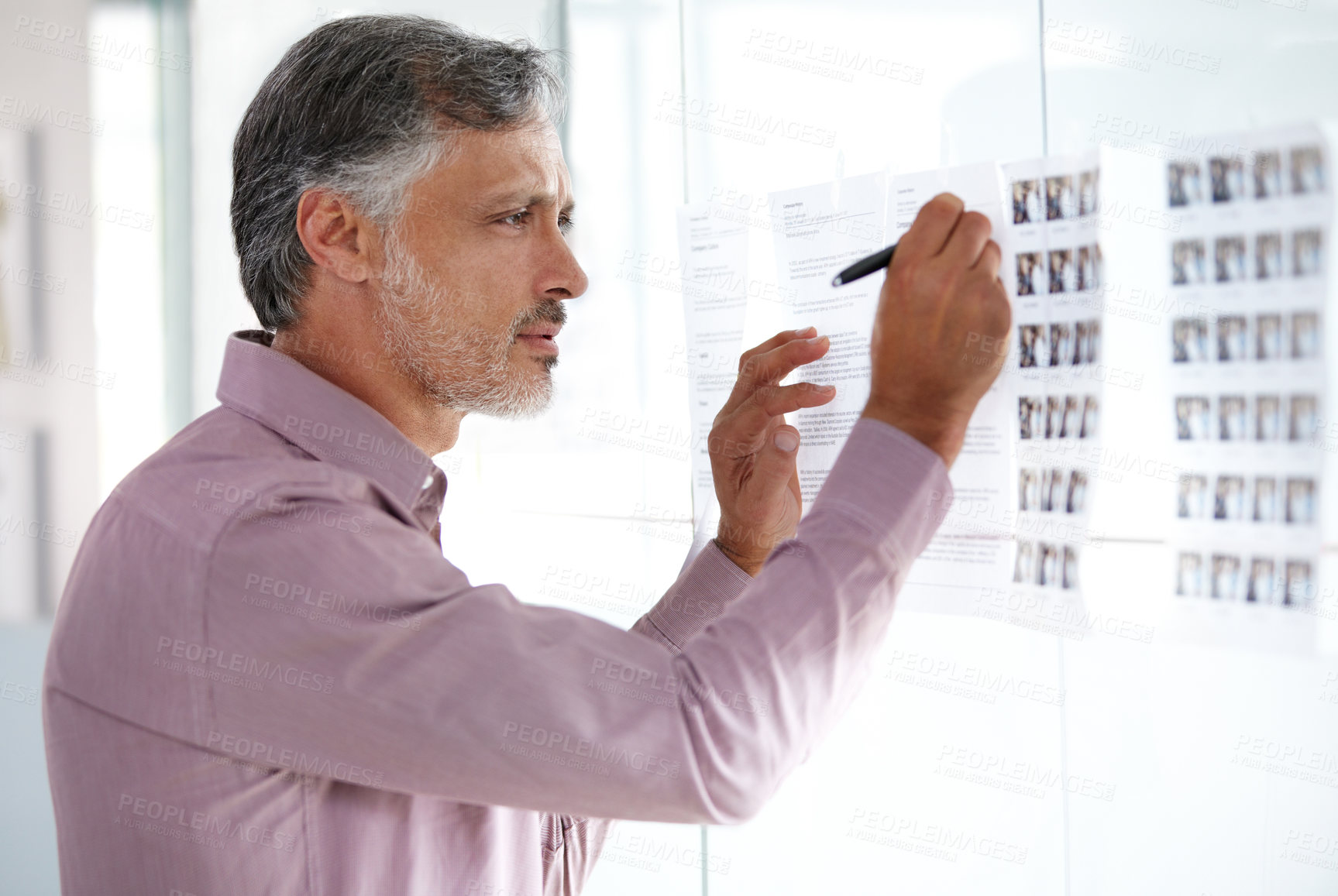 Buy stock photo Senior businessman, writing and planning on glass board for schedule, brainstorming or strategy at office. Mature man or employee working on project plan, agenda or tasks for vision at workplace