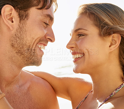 Buy stock photo Love, beach and happy couple hug outdoor with support, trust and care while bonding in nature together. Face, smile and people at sea with gratitude, fun or enjoying relationship, moment or romance