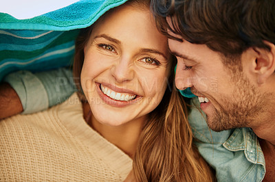 Buy stock photo Couple, outdoor and cover with towel for protection from cold in environment for weather, sun or wind. Man, woman and happy shelter for beach adventure or relax vacation for bonding, marriage or trip