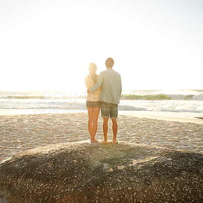 Buy stock photo Sunset beach, love and back of couple in nature with hug, support and bonding, travel or vacation. Summer, mockup and people embrace at sunrise with sunshine, ocean view or date at sea in Florida