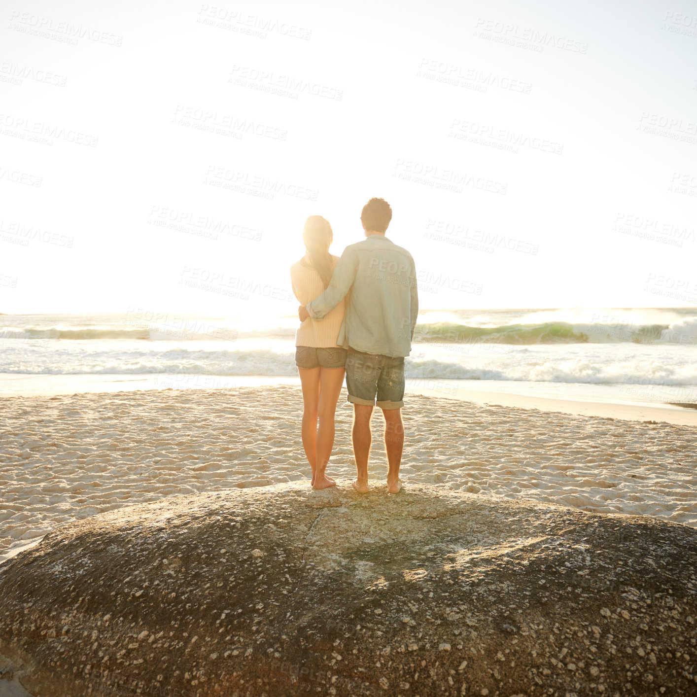 Buy stock photo Sunset beach, love and back of couple in nature with hug, support and bonding, travel or vacation. Summer, mockup and people embrace at sunrise with sunshine, ocean view or date at sea in Florida