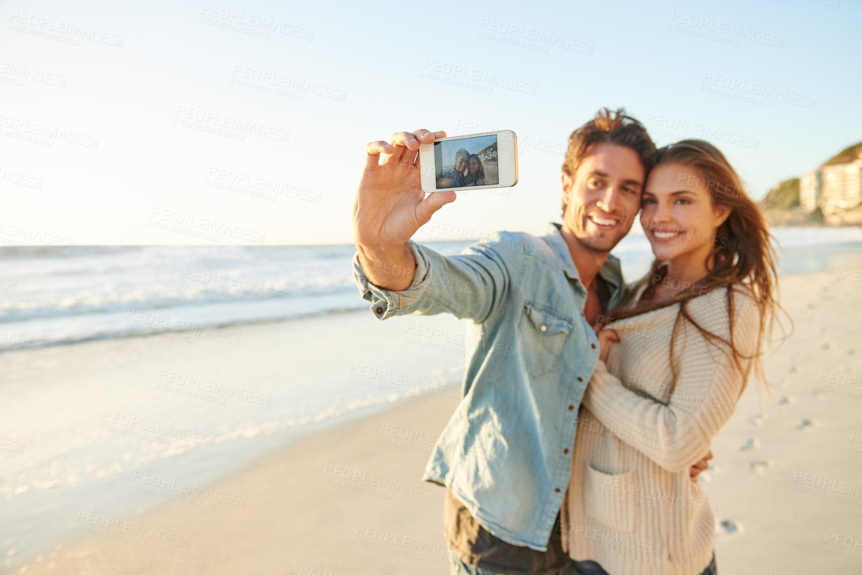 Buy stock photo Couple, beach and selfie with smile, hug and care with love, bonding and post update on web blog. Man, woman and photography for mobile app, profile picture and happy in summer sunshine for vacation