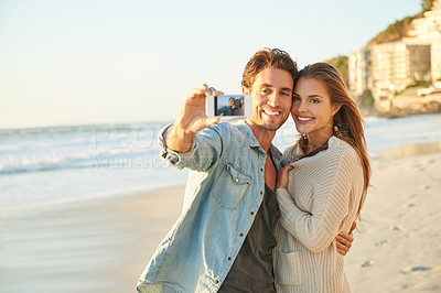 Buy stock photo Couple, selfie and happy for hug by ocean for memory on vacation with care, love and bonding in summer. Man, woman and nature for holiday with photography, profile picture and beach on social network