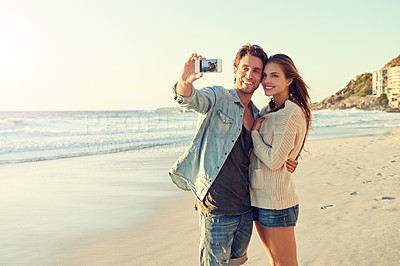 Buy stock photo Couple, selfie and smile for hug by sea for memory on vacation with care, love and tropical beach. Man, woman and smartphone screen for photography, profile picture and app at ocean on social media