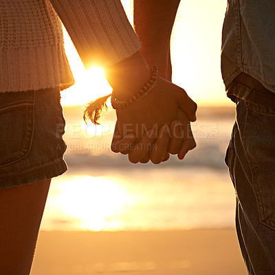 Buy stock photo Couple, holding hands and beach sunset for love at waves or vacation journey, peace or support. Partnership, fingers and environment at ocean for calm holiday or healing relationship, travel or trust