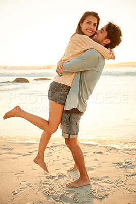 Buy stock photo Love, hug and portrait of couple at beach on vacation, adventure or holiday for valentines day. Sunset, happy and man carry, embrace and bond with woman by ocean for weekend trip on romantic date.