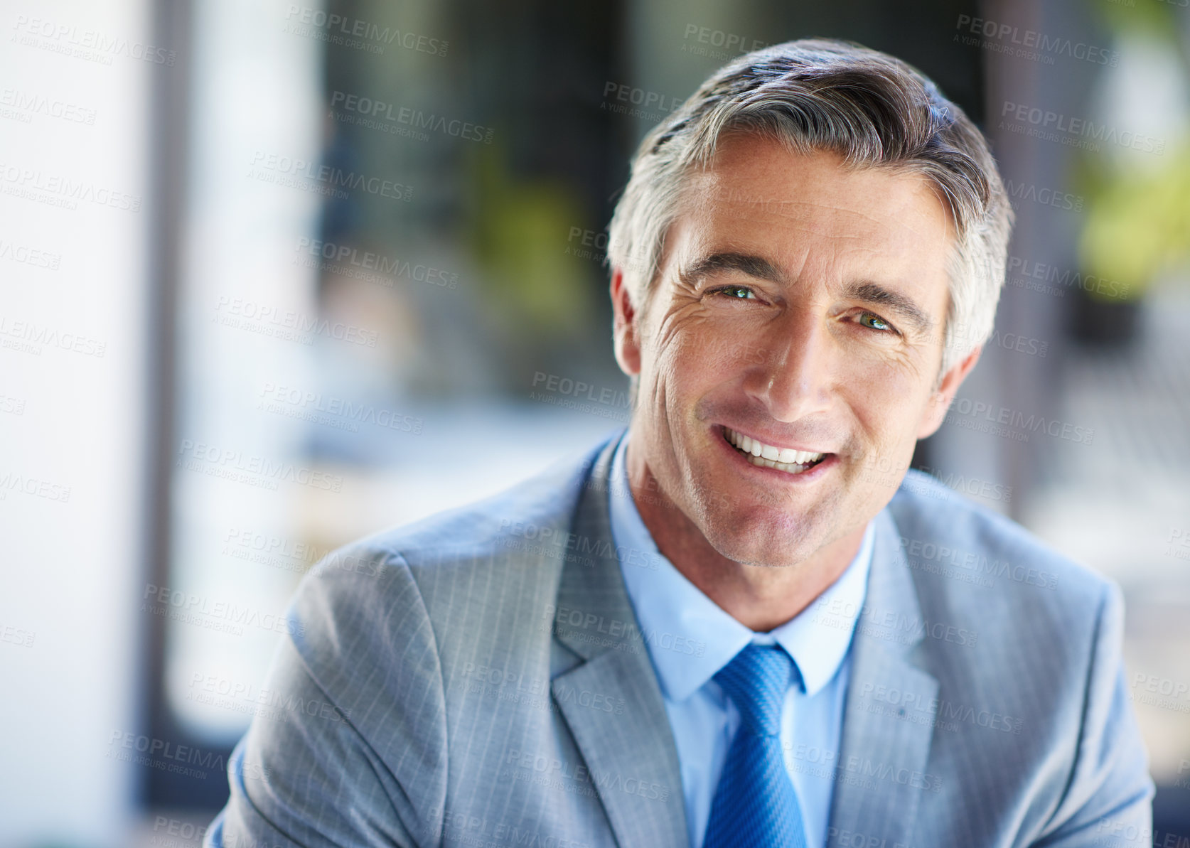 Buy stock photo Portrait of a confident-looking mature businessman