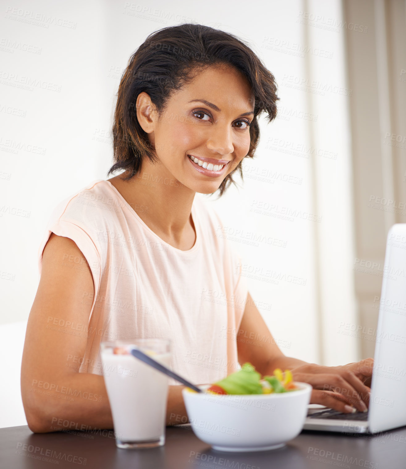 Buy stock photo Remote work, laptop and woman eating a salad, healthy food or nutrition in home and office. Happy, portrait and working on lunch break with fruit and vegetables for energy, wellness and diet