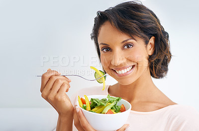 Buy stock photo Happy woman, portrait and vegan with salad bowl for diet, snack or natural nutrition against a studio background. Face of female person smile eating organic food for fiber, vitamins or healthy meal