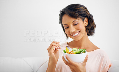 Buy stock photo Happy woman, bowl and eating salad for healthy diet, natural nutrition or wellness on living room sofa at home. Female person, vegan or nutritionist smile for vegetarian meal, fiber or vitamin snack