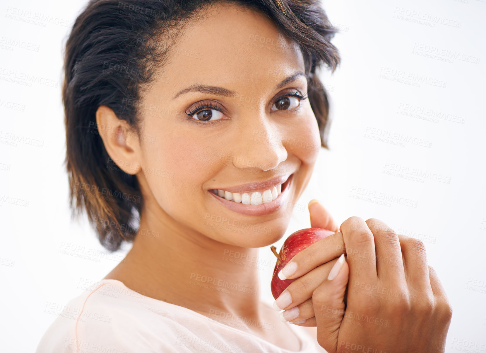 Buy stock photo Happy, apple and portrait of woman in a studio for wellness, nutrition and organic diet. Smile, vitamins and young female person from Mexico eating fruit for healthy vegan snack by white background.