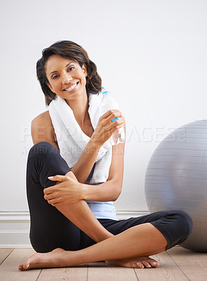 Buy stock photo Yoga portrait, water bottle or happy woman relax after exercise, home workout or drink beverage for hydration wellness. Liquid, pilates studio floor or sports athlete sitting on white background wall