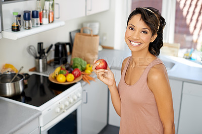 Buy stock photo Happy woman, portrait and apple in kitchen for healthy diet, snack or natural nutrition at home. Female person or vegan smile with red organic fruit for vitamin, food or health and wellness at house