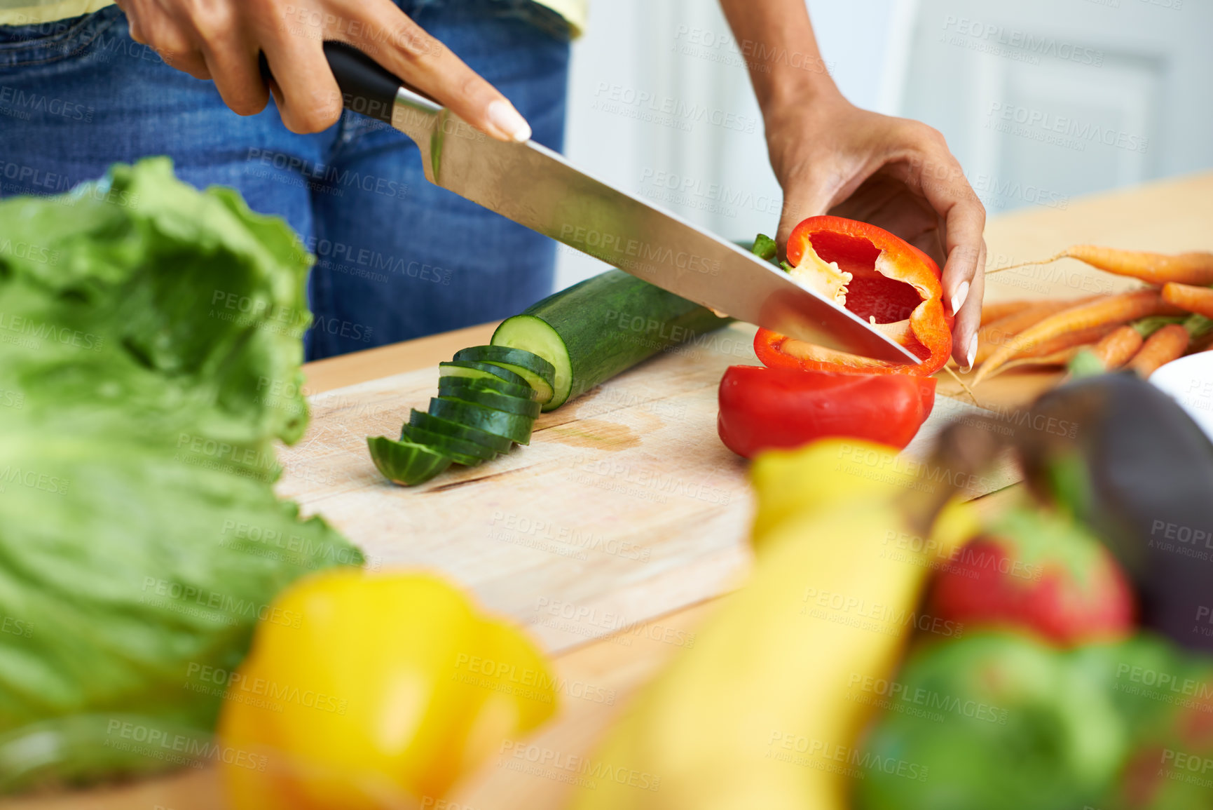 Buy stock photo Woman, hands and cutting vegetables in kitchen on wooden board for healthy diet or vegetarian meal at home. Closeup of female person slicing natural organic red pepper for salad preparation at house