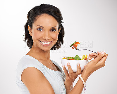 Buy stock photo Happy woman, portrait and fruit bowl for diet, salad or natural nutrition against a studio background. Female person or model smile with organic food, fiber or vitamins for healthy meal and wellness