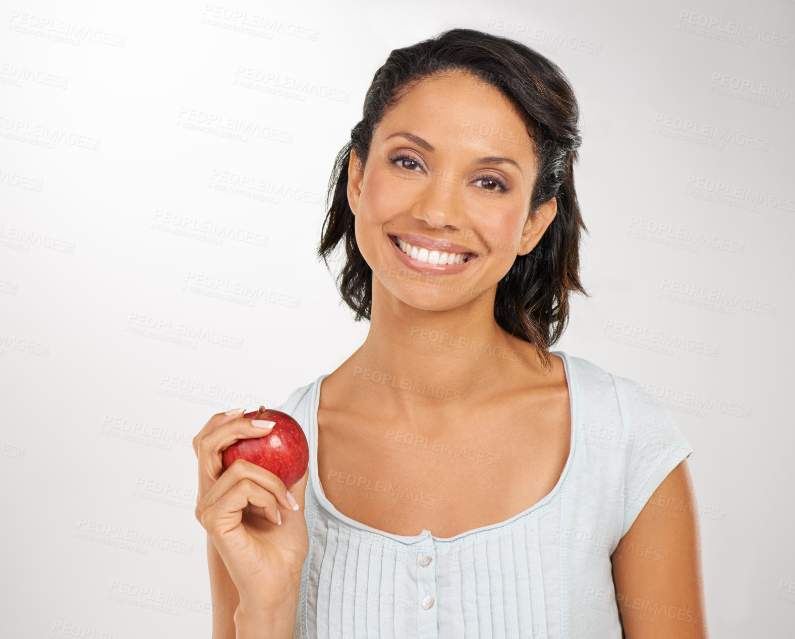 Buy stock photo Happy woman, portrait and apple for natural nutrition, health diet or snack against a studio background. Face of female person or model smile with red organic fruit for fiber, vitamin or healthy meal