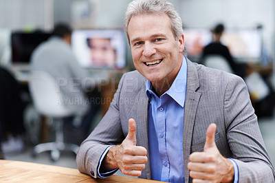 Buy stock photo Portrait of a mature businessman happily giving you a thumbs up