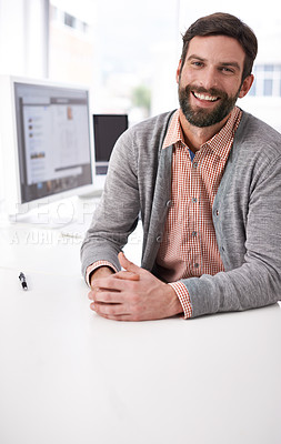 Buy stock photo Businessman, portrait and happy at desk in modern office, professional and career pride in company. Accountant, face or relax on break by computer, social media or networking on internet in workplace