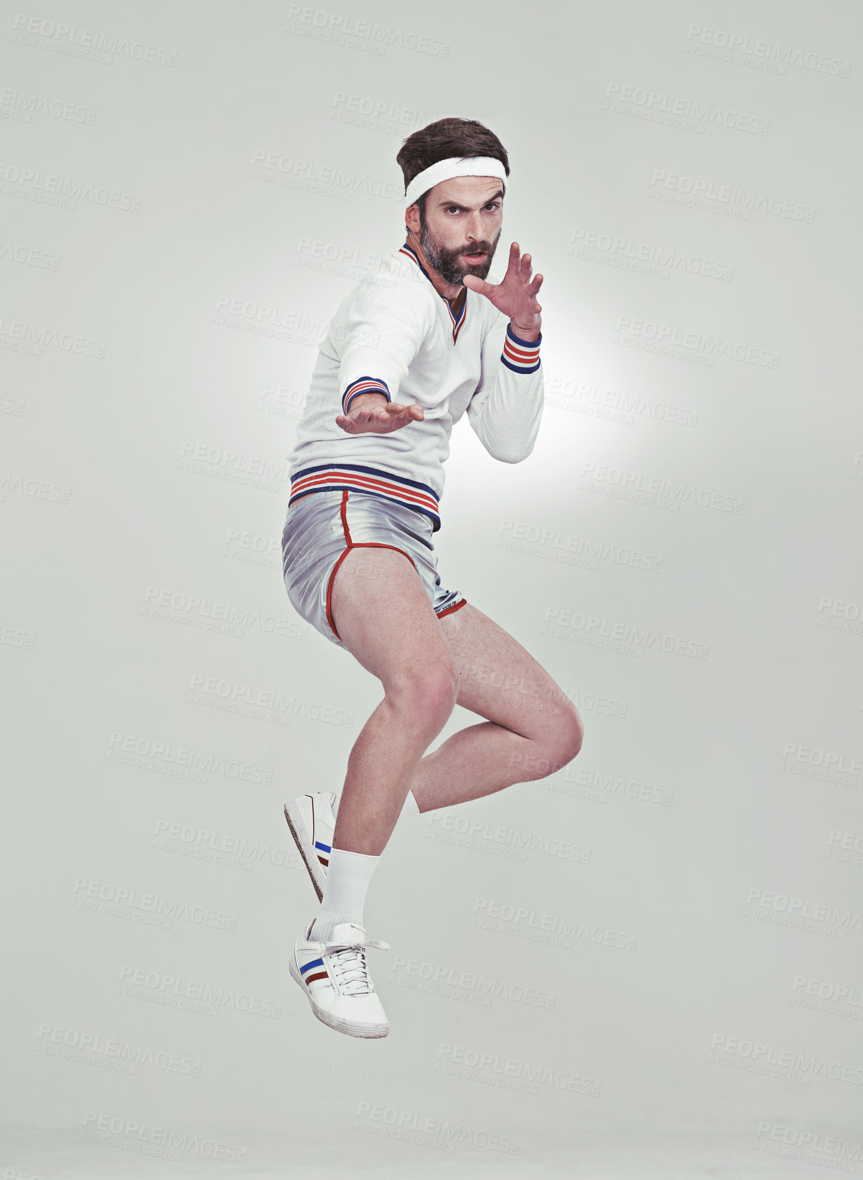 Buy stock photo A young man in the studio wearing retro sportswear and shades