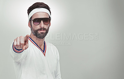 Buy stock photo Portrait of a young man pointing at you in the studio