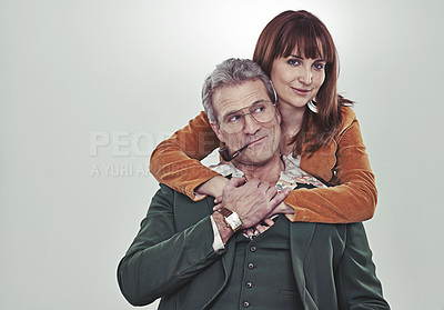 Buy stock photo Portrait, studio and couple with vintage clothes for fashion, outfit and unique style in suit. Grey background, hug and love for romance in marriage for partners, relationship and holding hands