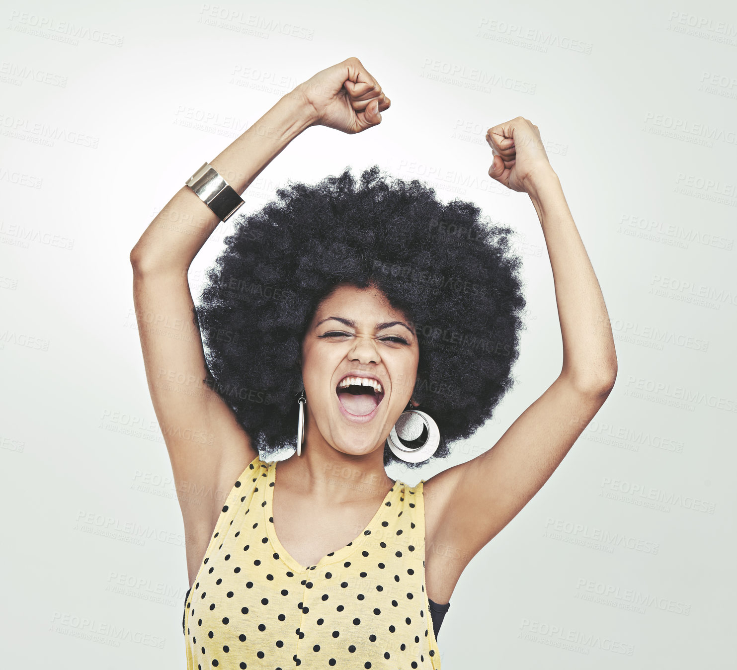 Buy stock photo Studio shot of a young woman in a retro outfit shouting with excitement while dancing