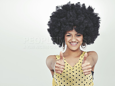 Buy stock photo Studio portrait of a young woman in a retro outfit showing thumbs up