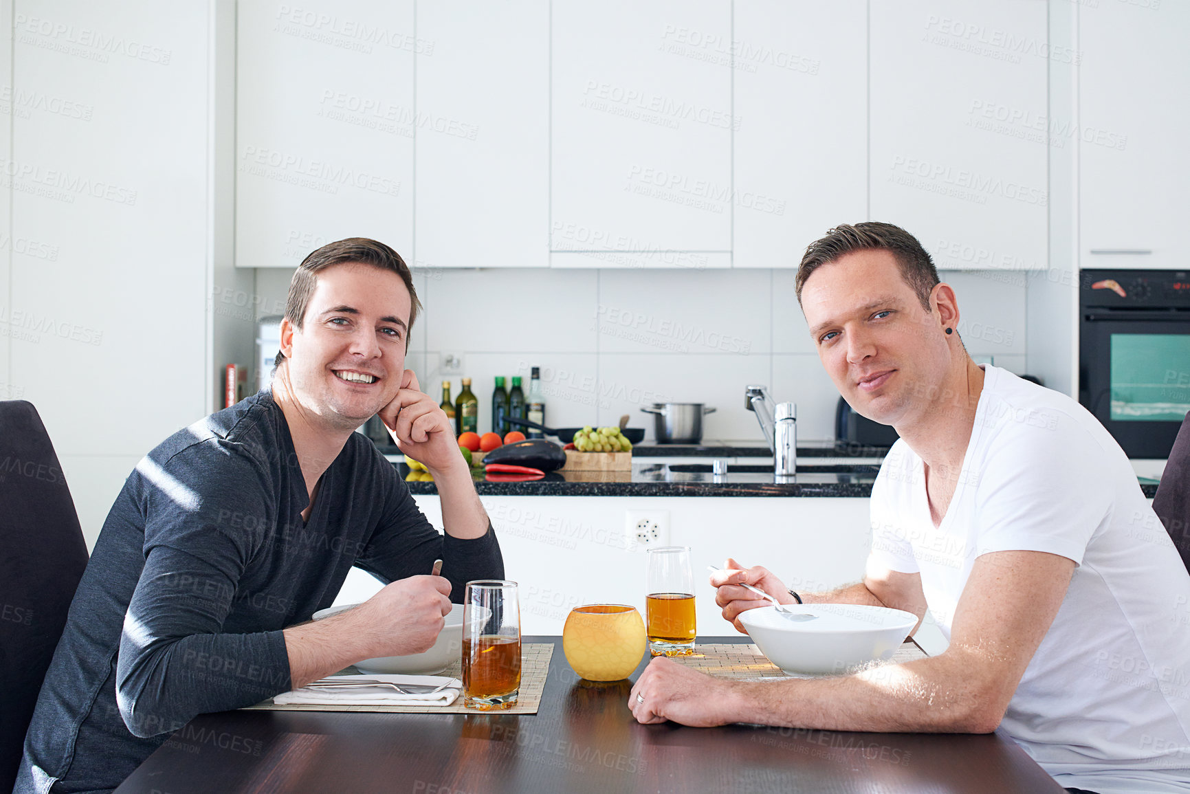 Buy stock photo Food, gay couple and home kitchen for breakfast, meal and bonding time on weekend. Partnership, married and male people in house for eating, nutrition and smile or portrait for lgbt relationship
