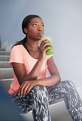 Buy stock photo Black woman, thinking and fitness with smoothie for detox, drinking or hydration in health and wellness on staircase. Young African, female person or wonder with organic beverage for weight loss