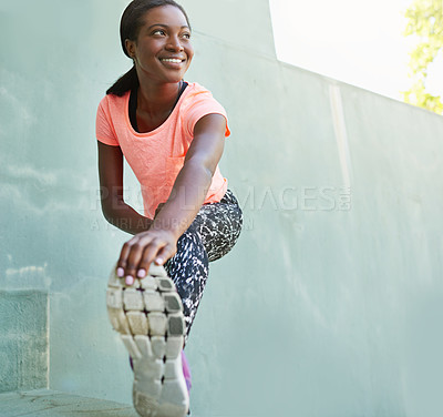 Buy stock photo Full length shot of an attractive young woman stretching outdoors