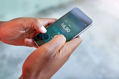 Buy stock photo High angle shot of a female athlete making setting up her workout playlist