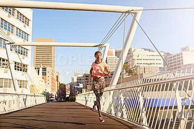 Buy stock photo Black woman, running and workout with bridge in city for cardio exercise, training or outdoor fitness. Young African, female person or active runner with asphalt or path for race, sprint or marathon