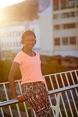 Buy stock photo Happy, portrait or black woman with headphones for fitness, music or audio streaming in city. Young African, female person or runner with smile for radio, workout podcast or exercise in an urban town