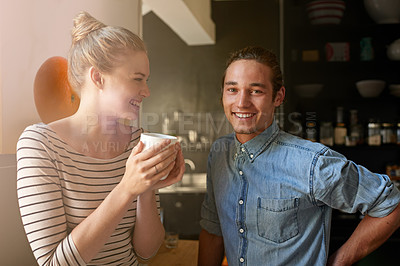 Buy stock photo Couple, coffee or portrait with bonding in kitchen for connection, laughing or funny morning in home. People, happy or relax with caffeine in house for support, loyalty and commitment to relationship