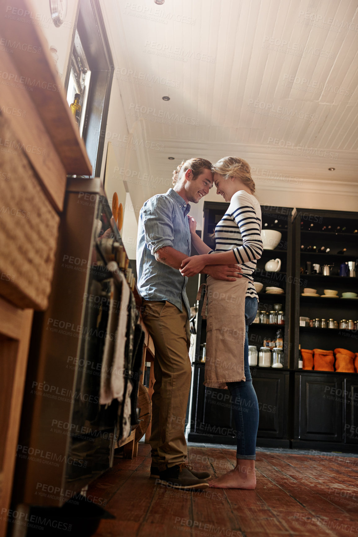 Buy stock photo Cooking, dancing or happy couple with romance in house kitchen for food, meal prep or nutrition. Low angle, care and people in apartment to celebrate anniversary for love at dinner, lunch or brunch