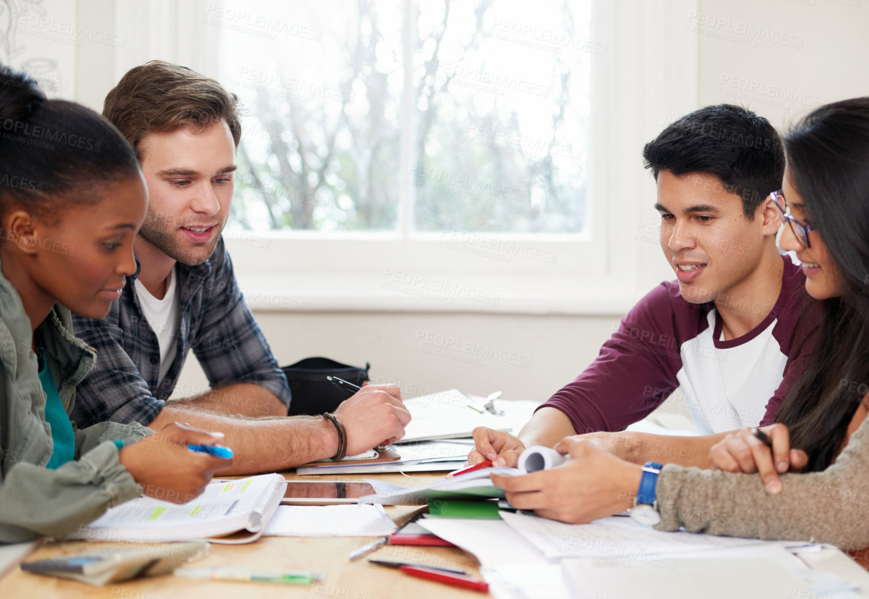 Buy stock photo Cropped shot of a group of university students in a study group