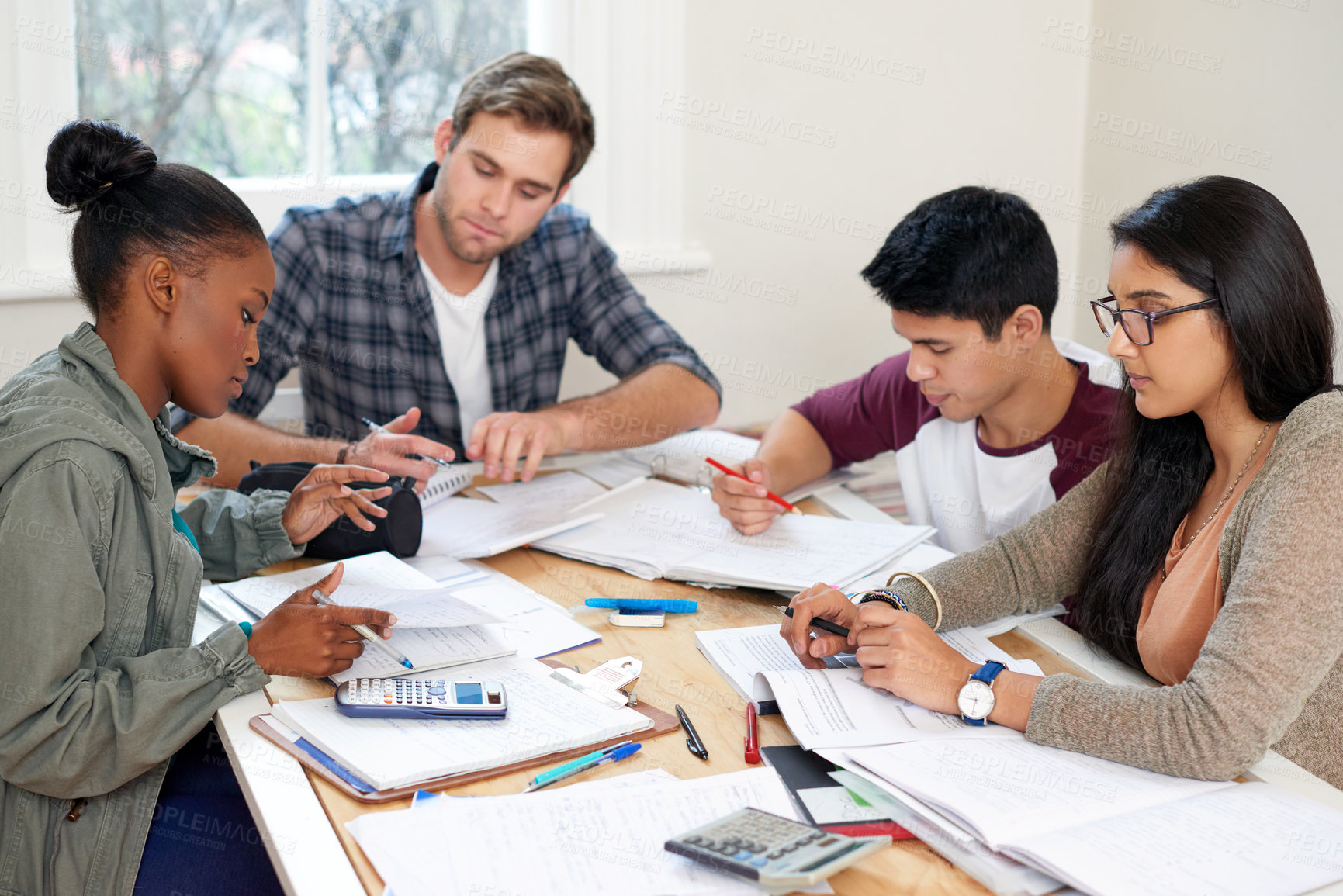 Buy stock photo Cropped shot of a group of university students in a study group