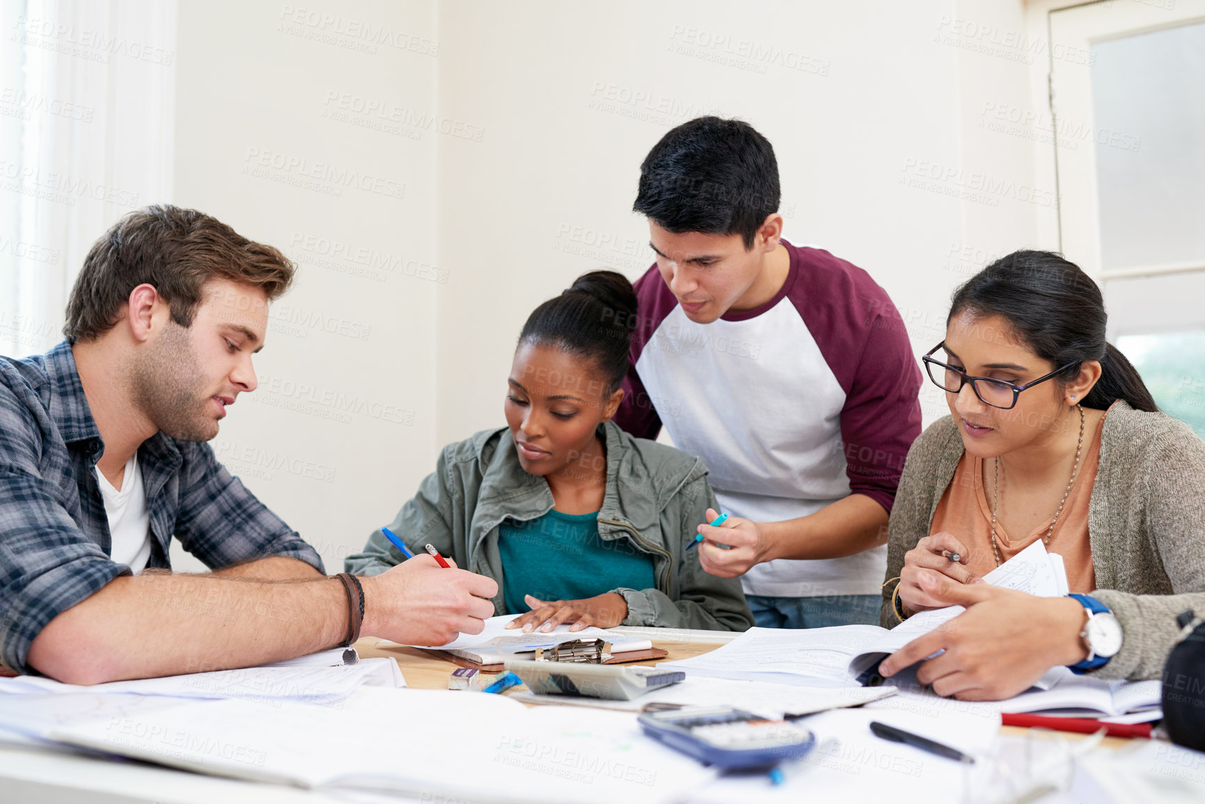 Buy stock photo Cropped shot of a group of university students in a study group