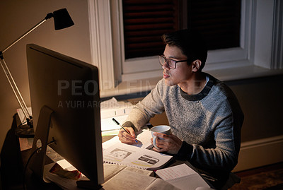 Buy stock photo Cropped shot of a young student studying late into the night