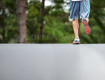 Buy stock photo Legs, outdoor and running on road for fitness with exercise for health with training. Runner, wellness and sport with athlete for endurance with distance marathon for workout with physical activity