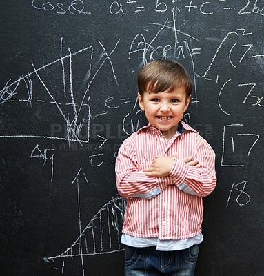 Buy stock photo Child, boy and portrait with math by blackboard with equations, happy and education in classroom at school. Kid, student and numbers for knowledge, learning and chalkboard with smile and preschool